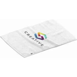 A white towel featuring a colourful logo and the word "CREATIVE" printed on it.
