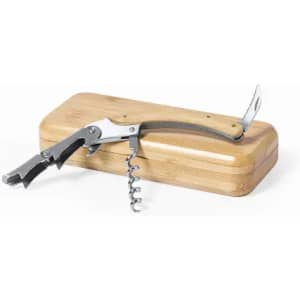 A corkscrew with a wooden handle resting on a rectangular bamboo box. The corkscrew features a metal spiral and lever.