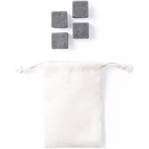 A set of four grey cooling stones next to a small white drawstring pouch.