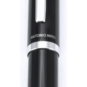 A black pen with a silver clip and band featuring a branding detail.