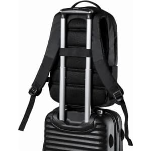 A black backpack resting on top of a black wheeled suitcase, featuring adjustable straps and a sleek design.
