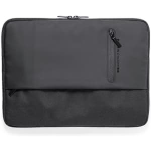 A laptop sleeve in black with a zippered compartment and a flat front pocket. It features a logo.