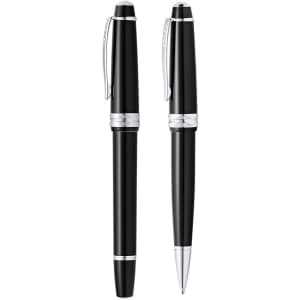 A set of black pens with silver accents, including a ballpoint and a rollerball pen. Both feature a sleek design.