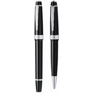 A set of black pens with silver accents, including a ballpoint and a rollerball pen. The pens feature a sleek design and clip.