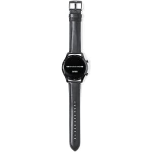 A smartwatch with a black round face and a black leather strap, featuring a silver buckle and branding.