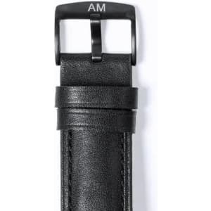 A black leather belt with a black metal buckle, featuring an engraved logo.