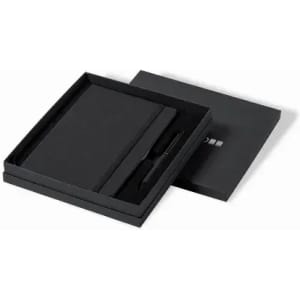 A gift set featuring a black notebook and pen, presented in a sleek black box with a lid.