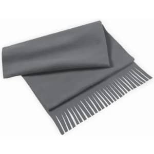 A grey blanket with a textured finish and fringed edges, folded neatly on a surface.