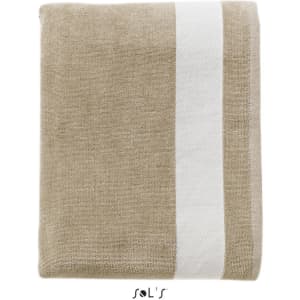 A folded beach towel in a sandy beige colour with a white stripe and a logo. Measuring 100cm x 160cm, made from velvet cotton.