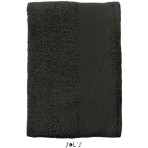 A heavy weight 500gsm cotton hand towel in dark grey, featuring a textured surface and a logo at the bottom.