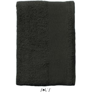 A heavy weight bath towel in dark grey, measuring 140cm x 70cm, with thick cotton fabric and a logo at the bottom.