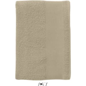 A large, heavyweight bath towel in a beige colour, measuring 150cm x 100cm, featuring a textured border and a logo.