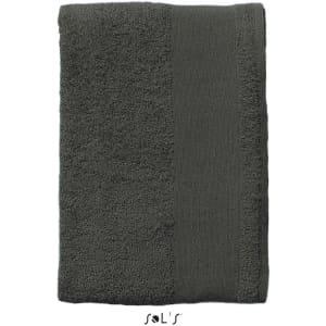 A large, dark grey bath towel, measuring 150cm x 100cm, made of heavy weight 500gsm cotton. Features branding.