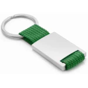 A green keychain featuring a rectangular silver metal attachment with a fabric loop.