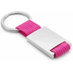 A keyring featuring a silver metal piece attached to a pink fabric strap.