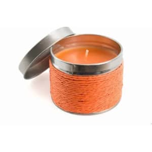 An orange candle in a tin container with a woven exterior, featuring a silver lid.