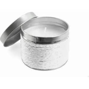 A candle in a metal tin with a rope design, featuring a white wax interior. The lid is slightly ajar.