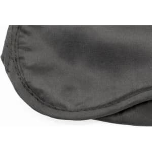 A grey sleep mask with a smooth fabric surface and a stitched edge. It has a simple, understated design.