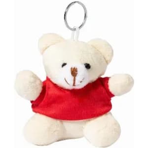 A soft teddy bear keychain with a red shirt and a keyring attachment, featuring a friendly smiling face.