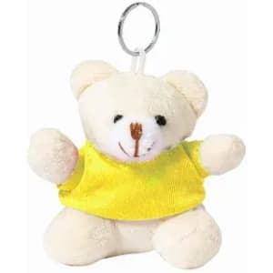 A cream teddy bear keychain wearing a yellow shirt, with arms outstretched and a keyring attached.