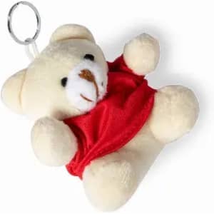A teddy bear keychain with a red outfit, featuring a soft cream body and small facial details. It has a metal ring.