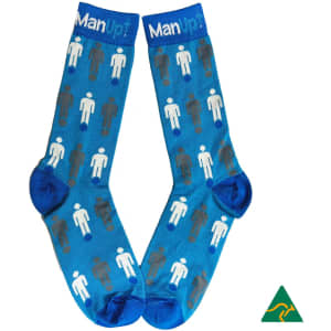 A pair of blue socks featuring a pattern of illustrated figures in various colours, with a logo on the top.
