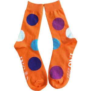 Bright orange socks featuring large multicoloured polka dots in blue, purple, and white. The design is playful and vibrant.