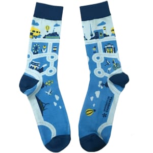 A pair of blue 3D printed dress socks featuring various colourful patterns and illustrations.