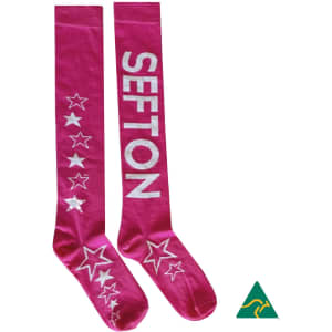 A pair of pink knee-high socks featuring stars and a logo, with the word "SEFTON" displayed on the side.