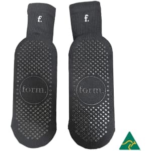 Black Crew Grip socks featuring a textured grip pattern and branding. Ideal for comfortable wear.