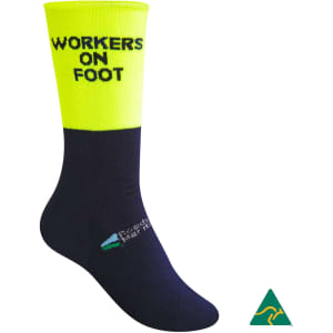 A pair of cotton full terry work socks in navy and high visibility yellow with a logo.