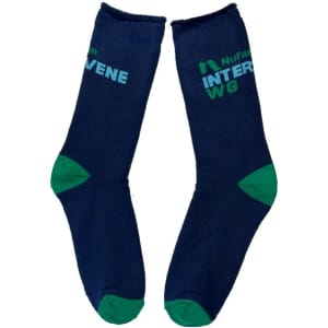 Cotton full terry work socks in navy blue with green accents, featuring a logo on one side.