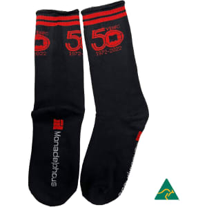 Black bamboo work socks with red detailing and branding, featuring a commemorative "50 Years" design.