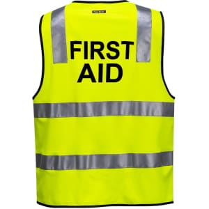 A high-visibility yellow vest with reflective strips, featuring the words "FIRST AID" on the back.