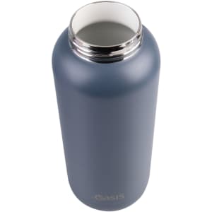 A drink bottle with a matte navy blue finish, featuring a stainless steel top and an engraved logo.