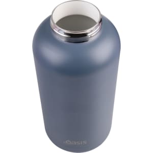 A drink bottle in a matte blue finish with a silver collar and a wide opening, featuring a logo.