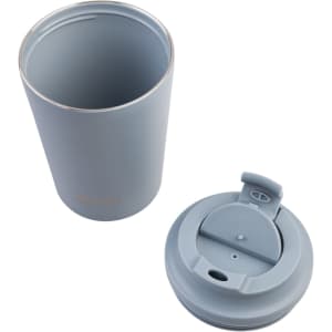 A ceramic lined insulated coffee cup in light blue, featuring a removable lid with a secure opening and a logo.