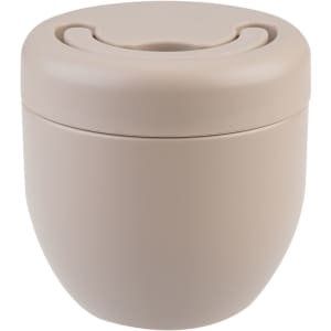 A vacuum food pod in a soft beige colour with a smooth, rounded design and a lid featuring a circular opening.