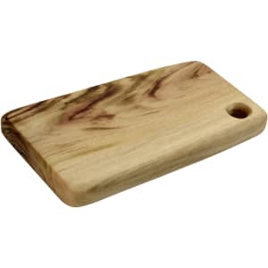 A wooden cheese board with a smooth surface and a small hole for hanging, featuring natural grain patterns.