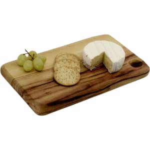 A wooden cheese board featuring round cheese, crackers, and grapes, showcasing natural tones and a smooth finish.