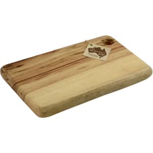 A wooden cheese board in a light brown hue, featuring a handle and an attached tag.