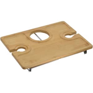 A bamboo picnic board featuring two drink holders and a central circular cutout for easy handling.