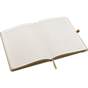 An open A5 notebook featuring blank lined pages with a light cream colour and a ribbon bookmark.