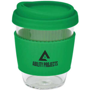 A drink bottle featuring a clear body, green silicone lid, and grip, with a logo on the side.
