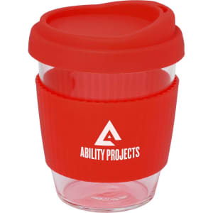 A drink bottle featuring a clear body and a red silicone lid and sleeve, with a logo on the side.