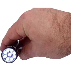 A hand holding a black mini torch featuring multiple bright LED lights. The torch includes a branding logo.