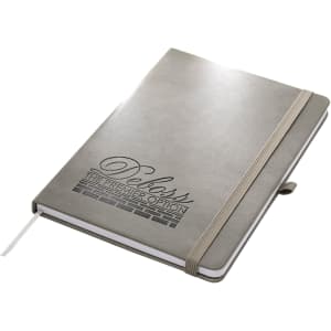 A grey A5 notebook with an elastic band and a ribbon marker, featuring a logo on the cover.