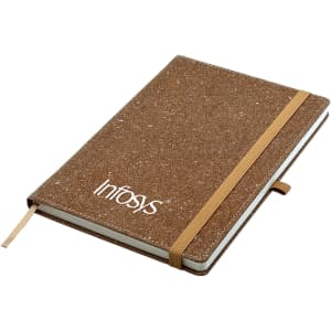 A brown bonded leather A5 notebook with an elastic band and a logo on the cover.