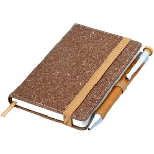 A brown bonded leather notebook with an elastic band and a pen attached, featuring a textured cover.