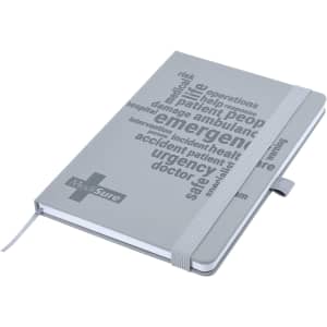 A grey A5 notebook with debossed text and an elastic band closure, featuring a logo on the cover.